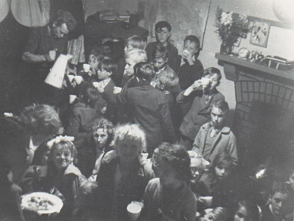 and later receiving squash from Sven and cakes from Jenny in front of the club house fireplace